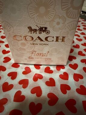 COACH Floral Box with Rose Gold Logo on Pale Pink